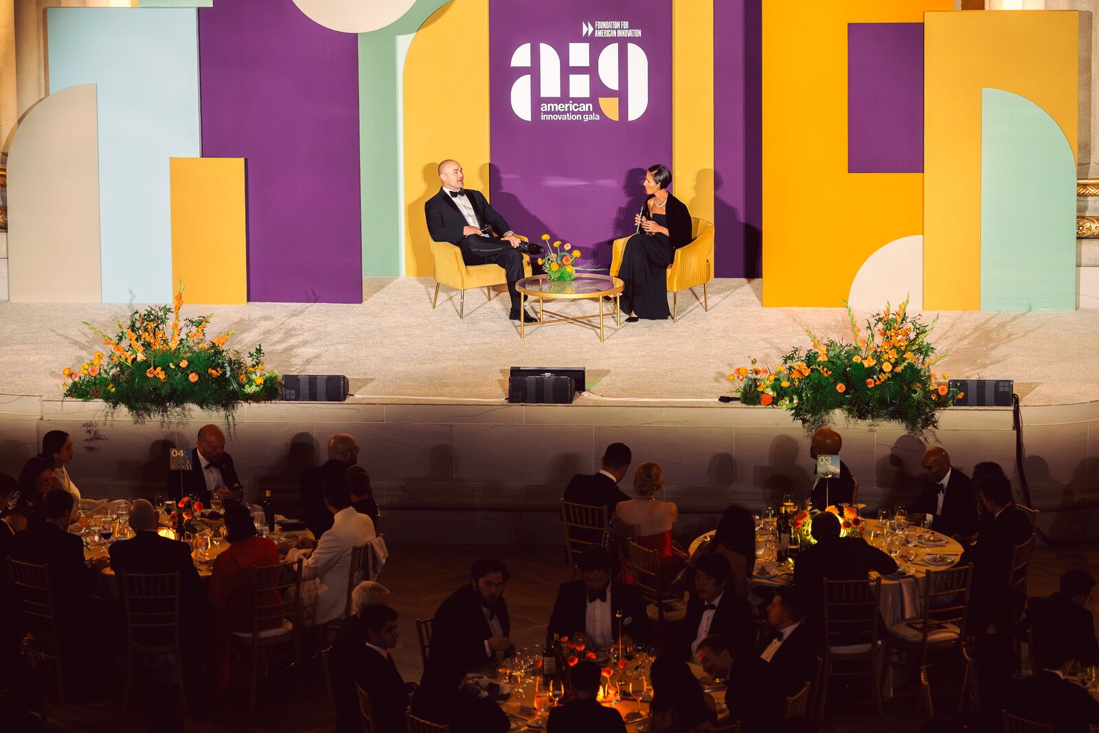 The dinner program stage beneath the auditorium arch